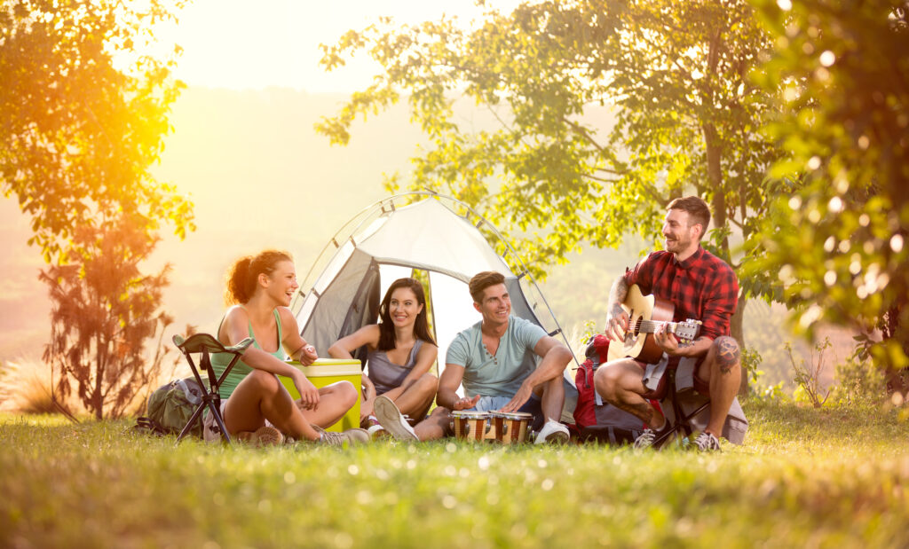 a group of people sitting in a tent